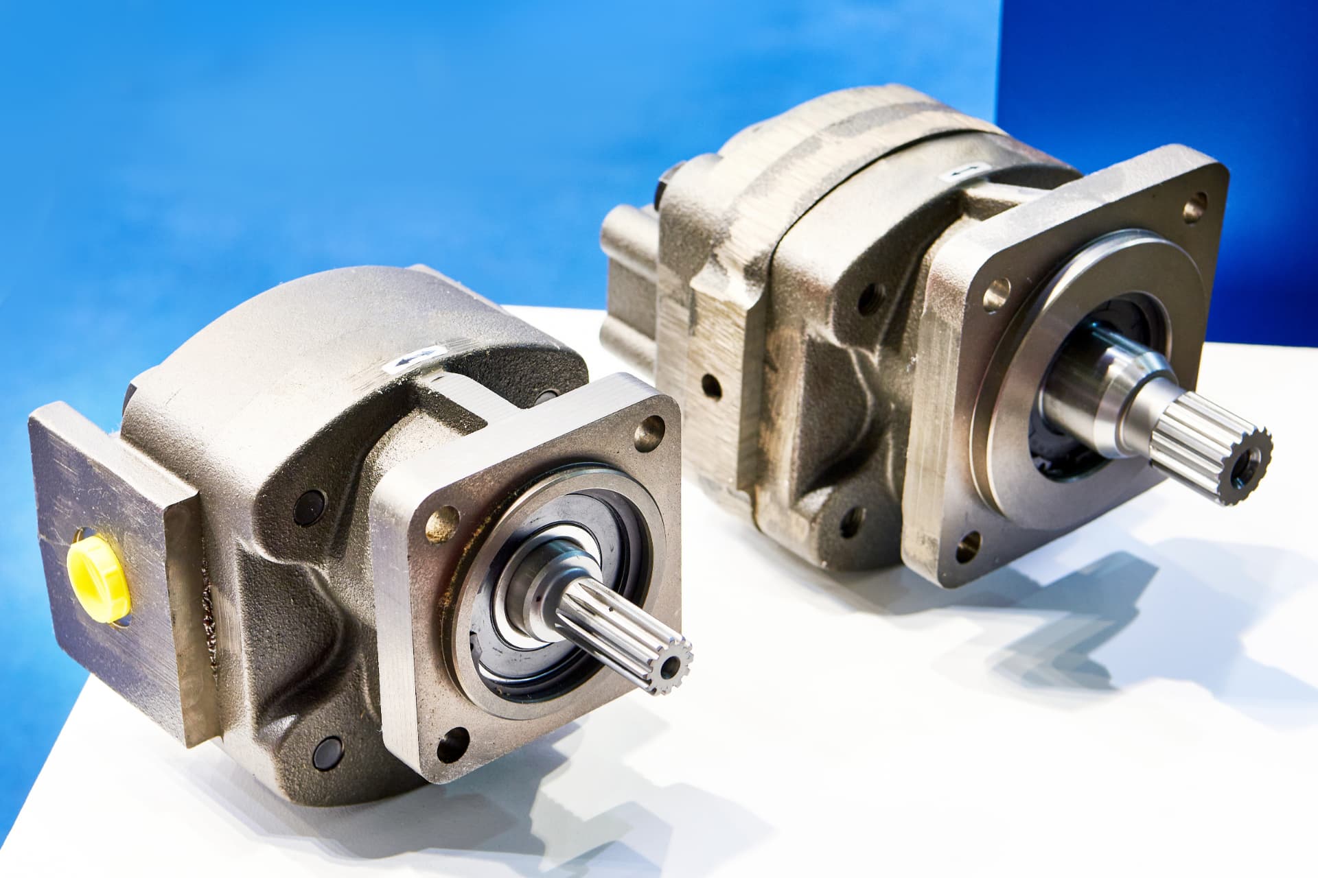 Two hydraulic pumps with machined drive shafts